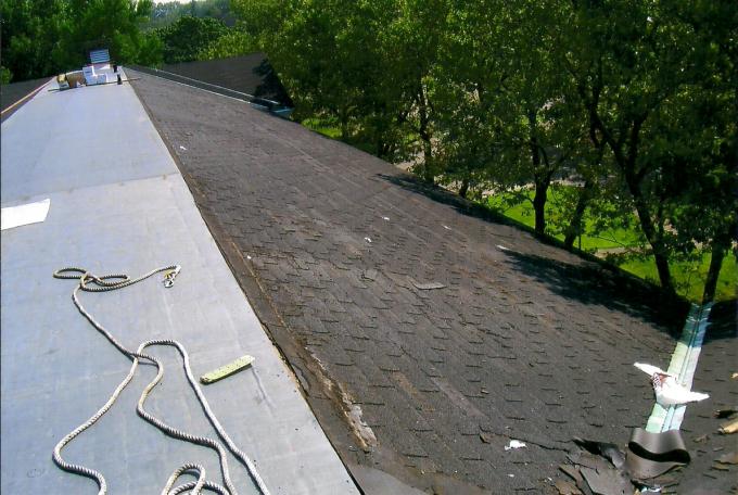 This is a picturre of a historical renovation of a buidling on Govenors Island, NY. This roof needed a large amount of shingles that could even have covered a entire football field.